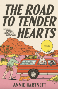 Book cover for  The Road to Tender Hearts  by Annie Hartnett. Image on cover is a simple, 1970s-style drawing of a person wearing a teal sweatshirt and brown shorts who is standing behind a station wagon and pushing the back of it as someone in the vehicle is driving. They must be stuck! They appear to be in the desert somewhere as there are cacti and a small, red mountain or large hill in the background. 