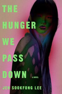 Book cover for . The Hunger We Pass Down  by Jen Sookfong Lee. Image on cover shows a painting of a frightened-looking woman who is peering over her shoulder at you from the shadows. 