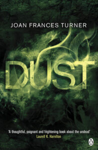 Book cover for Dust (Dust, #1) by Joan Frances Turner. The word dust in the title has been typographically designed to look like dust that has temporarily clumped together. There are still little green and yellow particles of dust flowing away from the word Dust, though. 