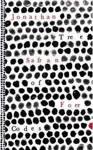 Book cover for Tree of Codes by Jonathan Safran Foer . Image on cover shows the title and author’s name written on a white background that is filled with with what looks like dozens of either smudged human fingerprints or little black oblong objects that are roughly that size and shape. 