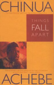 Book cover for Things Fall Apart (The African Trilogy, #1) by Chinua Achebe. Image on cover is a drawing of a middle-aged African man’s face who is staring thoughtfully into the distance. 