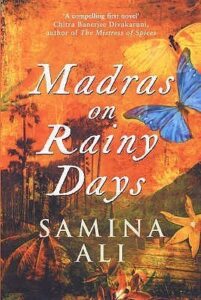 Book cover for Madras on Rainy Days by Samina Ali. Image on cover shows a blue butterfly and a yellow butterfly flying past falling autumn leaves outdoors. 