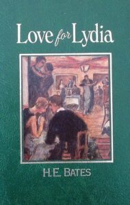 Book cover for Love for Lydia by H.E. Bates. Image on cover is a painting of a man wearing a suit and sitting in a restaurant or bar listening to a woman sing on stage. This looks like it was painted in the 1920 due to the flapper-style dress she is wearing. 