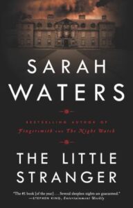 Book cover for The Little Stranger by Sarah Waters. Image on cover shows a drawing of a large country mansion just after dusk while the shadows are closing in on it. 