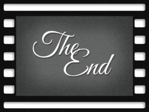 The phrase “the end” written in a cursive font against an old-fashioned film reel.