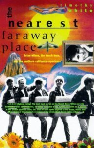 Book cover for The Nearest Far Away Place: Brian Wilson, the Beach Boys, and the Southern California Experience by Timothy White. Image on cover shows a cutout black and white photo of the members of the Beach Boys as young men against a drawing of a mountain range behind them, a sideways black and white photo of a young white woman on the upper right, and some flowers at their feet.